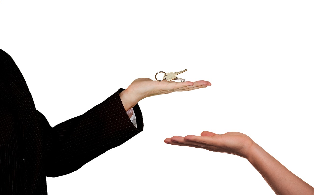Real estate agent handing the keys