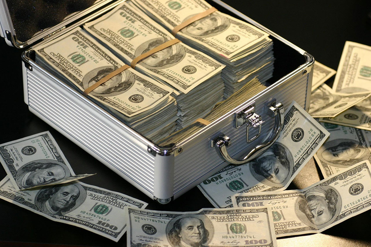 Stacks of 100-dollar bills in a hard case bag