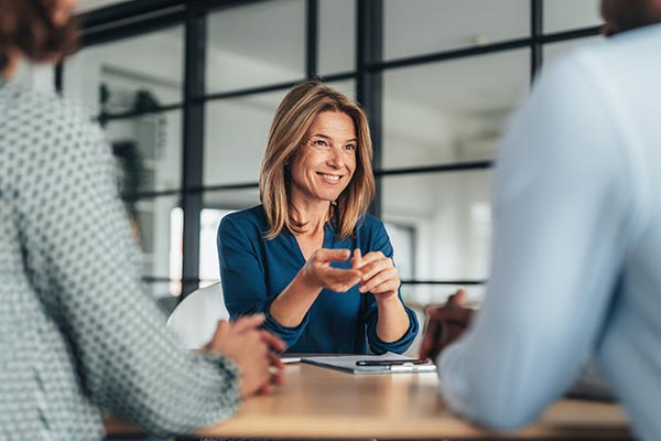 Female attorney speaking with clients about inheritance advance
