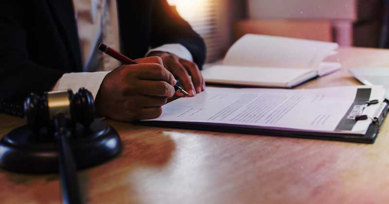 person signing paperwork