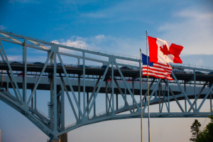canada and US flags flying